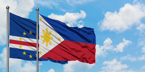 Cape Verde and Philippines flag waving in the wind against white cloudy blue sky together. Diplomacy concept, international relations.