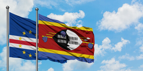 Cape Verde and Swaziland flag waving in the wind against white cloudy blue sky together. Diplomacy...