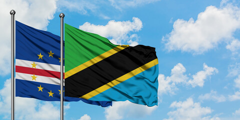 Cape Verde and Tanzania flag waving in the wind against white cloudy blue sky together. Diplomacy concept, international relations.