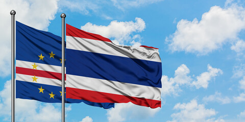 Cape Verde and Thailand flag waving in the wind against white cloudy blue sky together. Diplomacy concept, international relations.