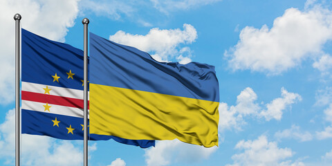 Cape Verde and Ukraine flag waving in the wind against white cloudy blue sky together. Diplomacy concept, international relations.