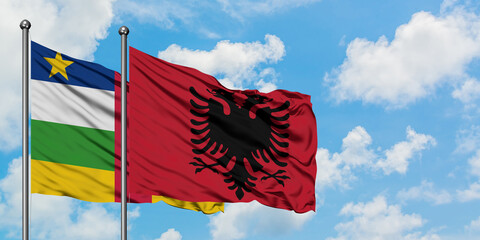 Central African Republic and Albania flag waving in the wind against white cloudy blue sky together. Diplomacy concept, international relations.