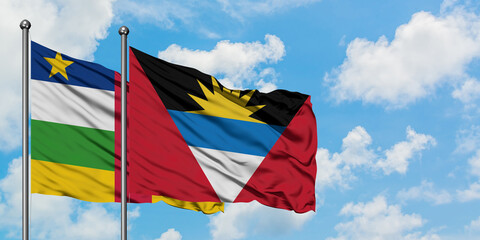 Central African Republic and Antigua and Barbuda flag waving in the wind against white cloudy blue sky together. Diplomacy concept, international relations.