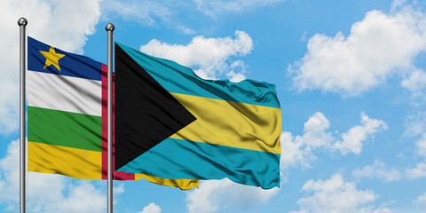 Central African Republic and Bahamas flag waving in the wind against white cloudy blue sky together. Diplomacy concept, international relations.