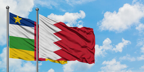 Central African Republic and Bahrain flag waving in the wind against white cloudy blue sky together. Diplomacy concept, international relations.