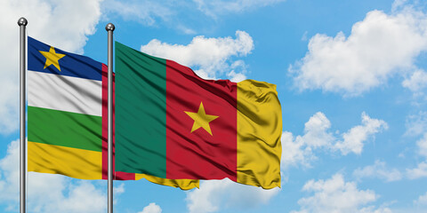 Central African Republic and Cameroon flag waving in the wind against white cloudy blue sky together. Diplomacy concept, international relations.