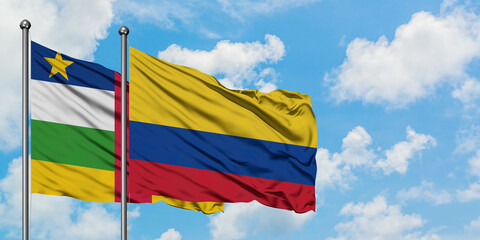Central African Republic and Colombia flag waving in the wind against white cloudy blue sky together. Diplomacy concept, international relations.