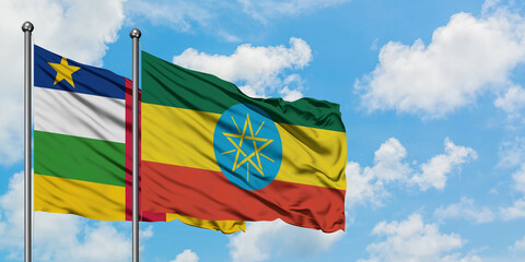 Central African Republic and Ethiopia flag waving in the wind against white cloudy blue sky together. Diplomacy concept, international relations.