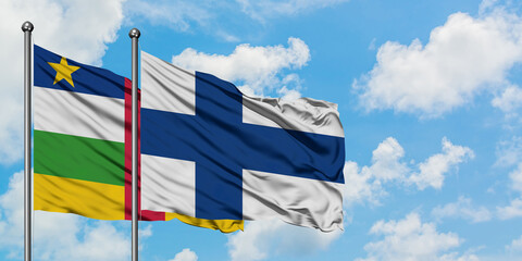 Central African Republic and Finland flag waving in the wind against white cloudy blue sky...