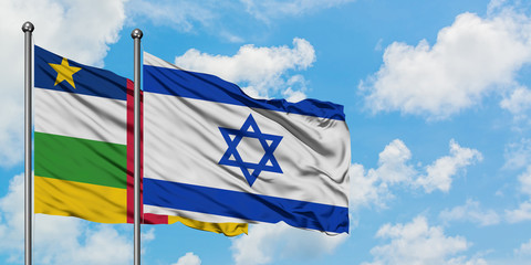 Central African Republic and Israel flag waving in the wind against white cloudy blue sky together. Diplomacy concept, international relations.