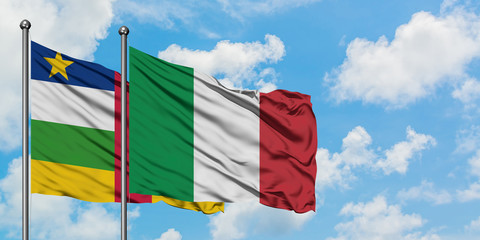 Central African Republic and Italy flag waving in the wind against white cloudy blue sky together. Diplomacy concept, international relations.