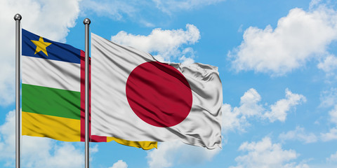 Central African Republic and Japan flag waving in the wind against white cloudy blue sky together. Diplomacy concept, international relations.