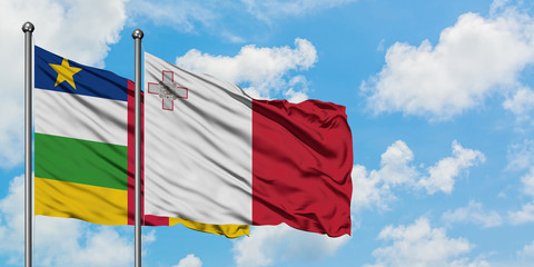 Central African Republic and Malta flag waving in the wind against white cloudy blue sky together. Diplomacy concept, international relations.