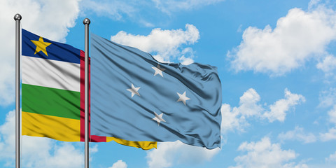 Central African Republic and Micronesia flag waving in the wind against white cloudy blue sky together. Diplomacy concept, international relations.