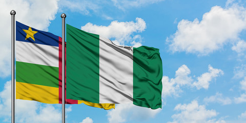 Central African Republic and Nigeria flag waving in the wind against white cloudy blue sky together. Diplomacy concept, international relations.