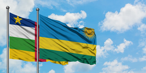 Central African Republic and Rwanda flag waving in the wind against white cloudy blue sky together. Diplomacy concept, international relations.