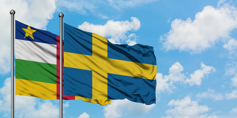 Central African Republic and Sweden flag waving in the wind against white cloudy blue sky together. Diplomacy concept, international relations.