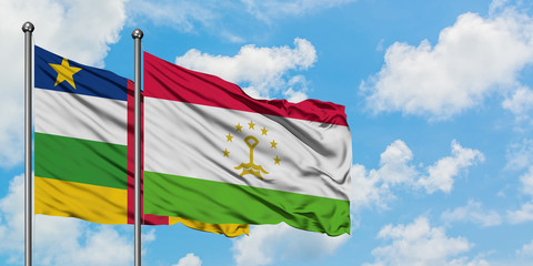 Central African Republic and Tajikistan flag waving in the wind against white cloudy blue sky together. Diplomacy concept, international relations.