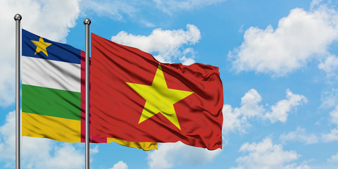 Central African Republic and Vietnam flag waving in the wind against white cloudy blue sky together. Diplomacy concept, international relations.