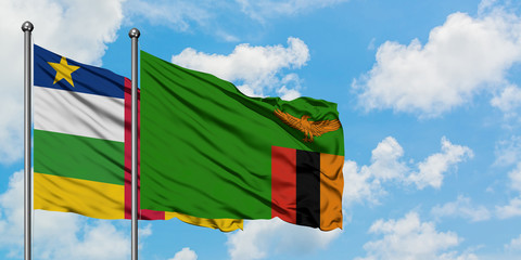 Central African Republic and Zambia flag waving in the wind against white cloudy blue sky together. Diplomacy concept, international relations.