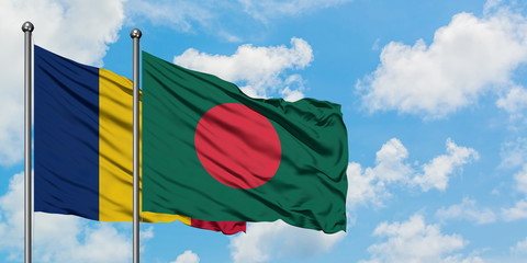 Chad and Bangladesh flag waving in the wind against white cloudy blue sky together. Diplomacy concept, international relations.