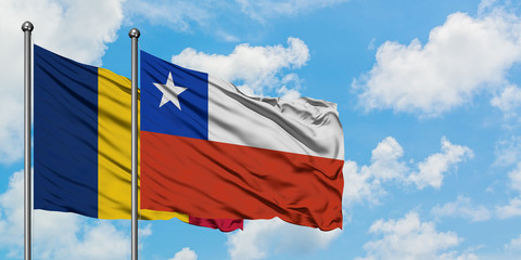 Chad and Chile flag waving in the wind against white cloudy blue sky together. Diplomacy concept, international relations.