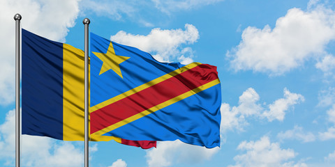 Chad and Congo flag waving in the wind against white cloudy blue sky together. Diplomacy concept, international relations.
