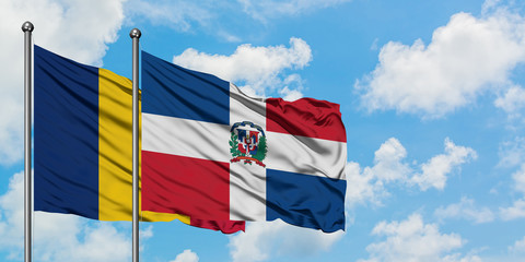 Chad and Dominican Republic flag waving in the wind against white cloudy blue sky together. Diplomacy concept, international relations.