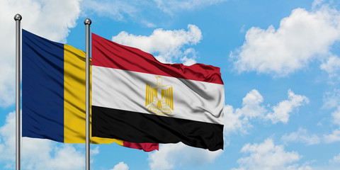 Chad and Egypt flag waving in the wind against white cloudy blue sky together. Diplomacy concept, international relations.