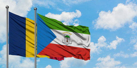 Chad and Equatorial Guinea flag waving in the wind against white cloudy blue sky together. Diplomacy concept, international relations.