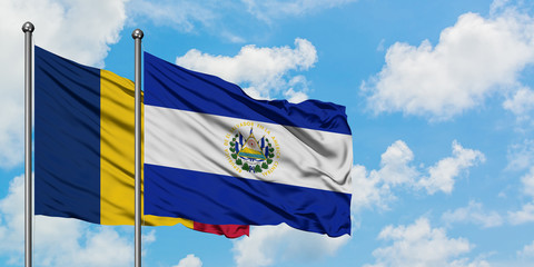 Chad and El Salvador flag waving in the wind against white cloudy blue sky together. Diplomacy concept, international relations.
