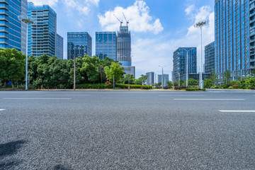 cityscape and skyline of suzhou from empty asphalt road