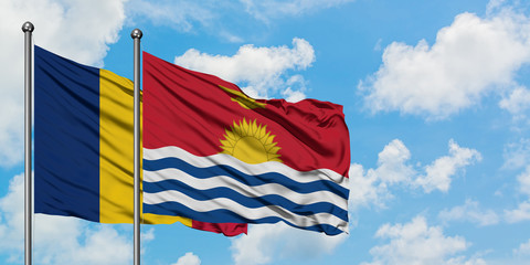 Chad and Kiribati flag waving in the wind against white cloudy blue sky together. Diplomacy concept, international relations.