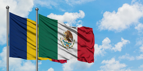 Chad and Mexico flag waving in the wind against white cloudy blue sky together. Diplomacy concept,...