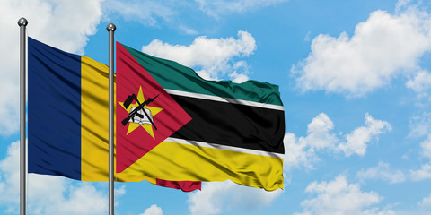 Chad and Mozambique flag waving in the wind against white cloudy blue sky together. Diplomacy concept, international relations.