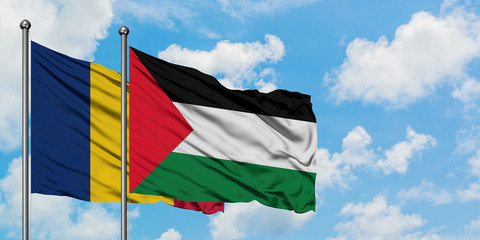 Chad and Palestine flag waving in the wind against white cloudy blue sky together. Diplomacy concept, international relations.