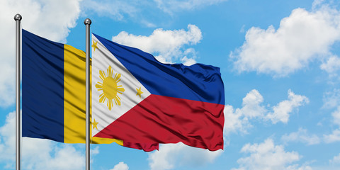 Chad and Philippines flag waving in the wind against white cloudy blue sky together. Diplomacy concept, international relations.