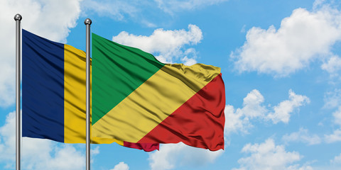 Chad and Republic Of The Congo flag waving in the wind against white cloudy blue sky together. Diplomacy concept, international relations.