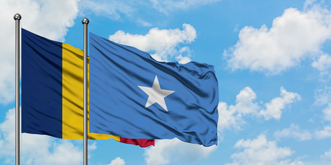 Chad and Somalia flag waving in the wind against white cloudy blue sky together. Diplomacy concept, international relations.
