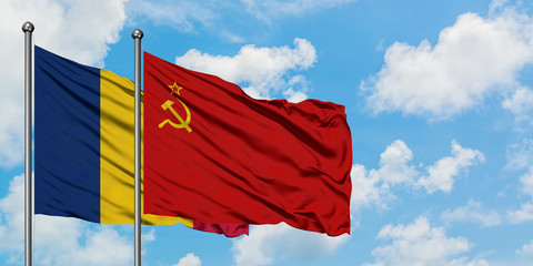 Chad and Soviet Union flag waving in the wind against white cloudy blue sky together. Diplomacy concept, international relations.