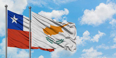Chile and Cyprus flag waving in the wind against white cloudy blue sky together. Diplomacy concept,...