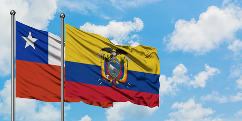 Chile and Ecuador flag waving in the wind against white cloudy blue sky together. Diplomacy concept, international relations.