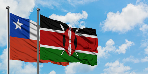 Chile and Kenya flag waving in the wind against white cloudy blue sky together. Diplomacy concept, international relations.