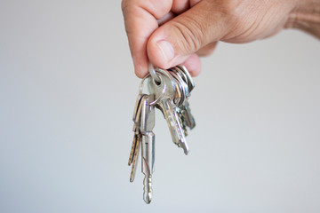 Man holding keys with his hands