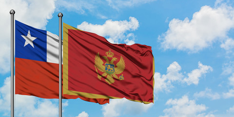 Chile and Montenegro flag waving in the wind against white cloudy blue sky together. Diplomacy concept, international relations.
