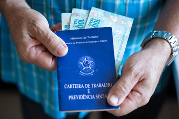 Man holding with hands Brazilian document work and social security