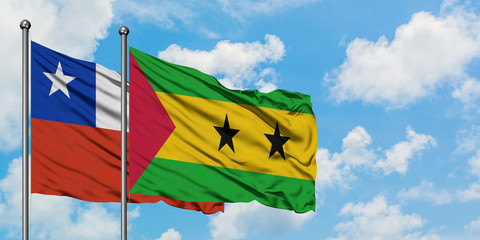 Chile and Sao Tome And Principe flag waving in the wind against white cloudy blue sky together. Diplomacy concept, international relations.