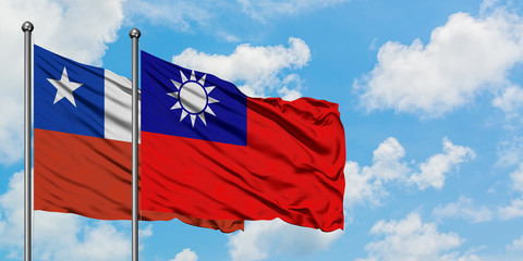 Chile and Taiwan flag waving in the wind against white cloudy blue sky together. Diplomacy concept, international relations.