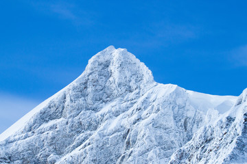 Wonderful Winter Landscape. Splendid Alpine scenery: Snowy Mountains at Grindelwald, Switzerland. Snow-covered mountains. Winter travel concept.