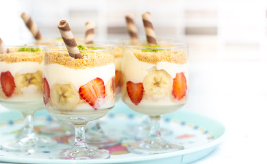 magnolia dessert, strawberries and banana on tray